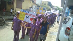 Students holding cancer awareness banners with SSVS